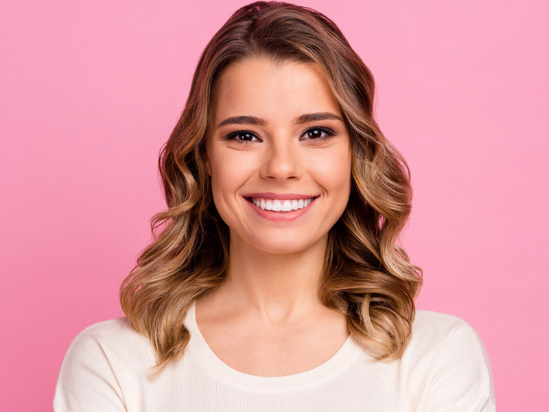 smiling girl pink background